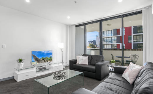 Wollongong Crown 2 bed study corporate apartment lounge