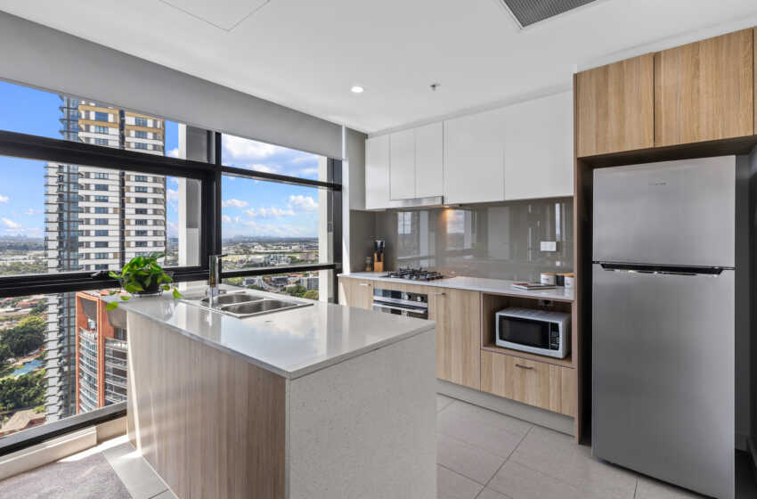 Full sized kitchen in Astra Apartments 2 bedroom corporate apartments Hassall St