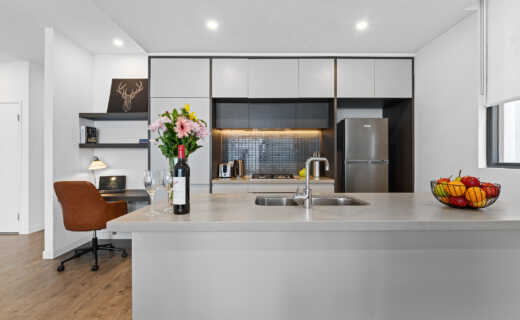 Astra Apartments Penrith Accommodation - kitchen and study desk in 2 bedroom apartment