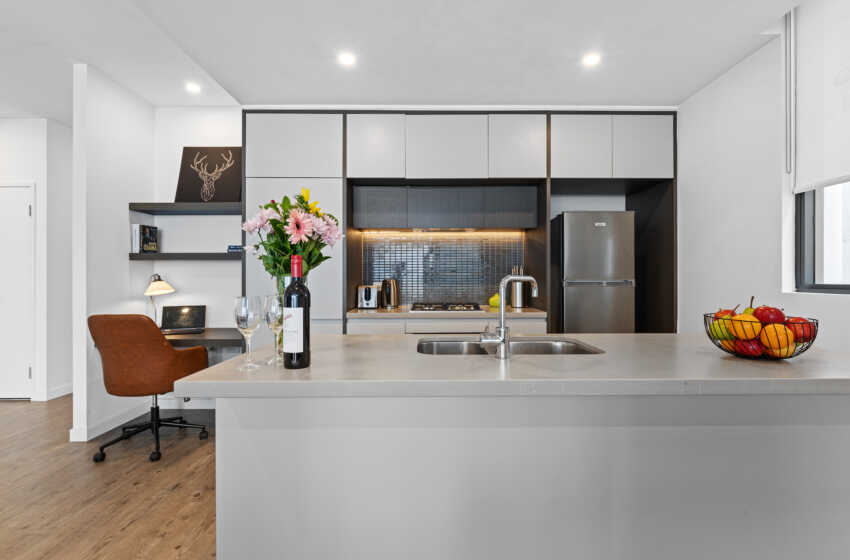 Astra Apartments Penrith Accommodation - kitchen and study desk in 2 bedroom apartment